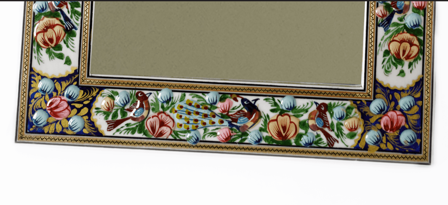 hand-painted enamel wall mirror with intricate bird and floral frame design by pilardi.