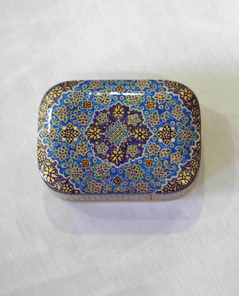 handmade wooden keepsake box featuring intricate hand-painted miniature artwork and vibrant colors.