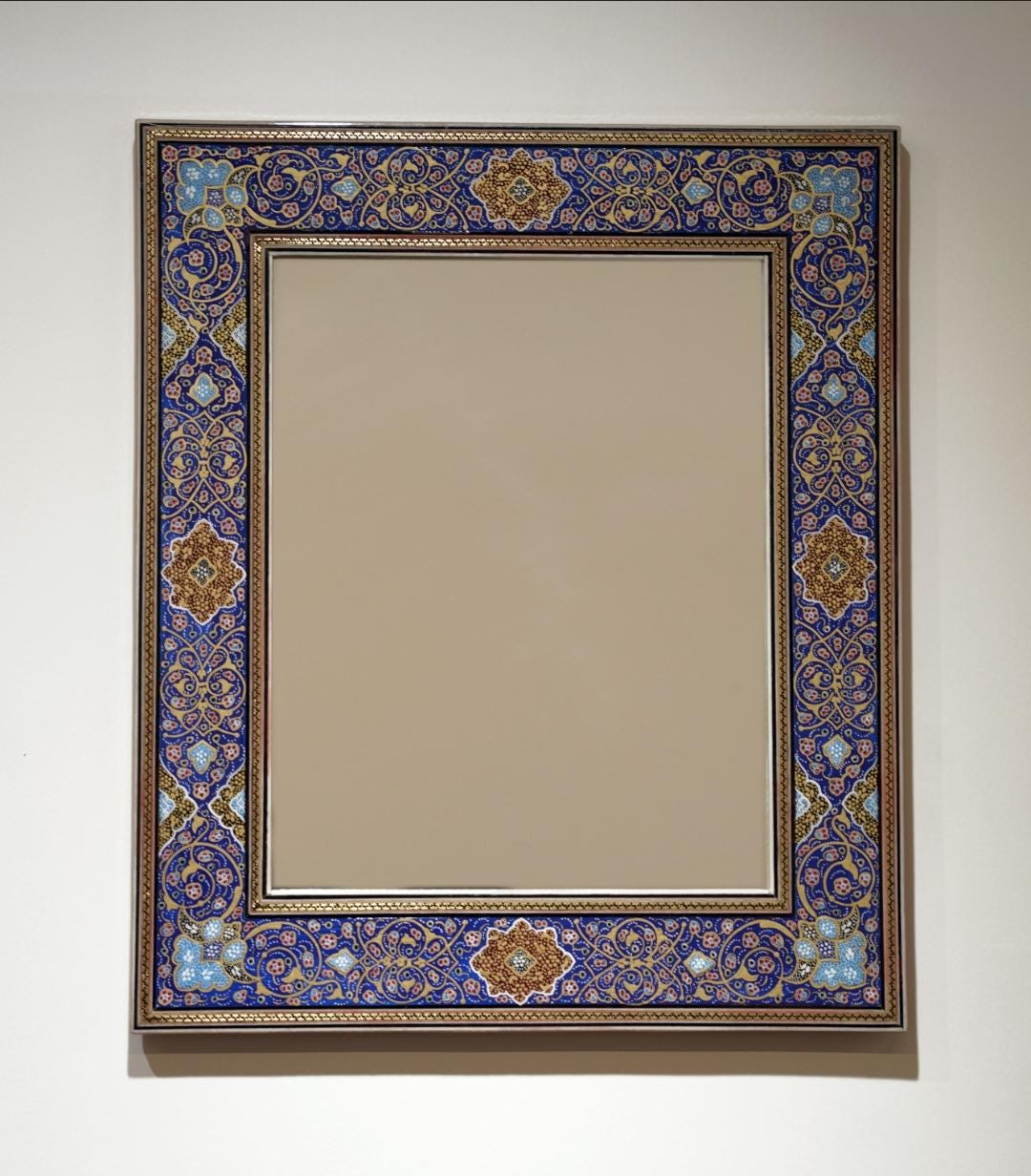 hand-painted tazhib mirror in deep indigo with floral motifs, showcasing artisan craftsmanship.