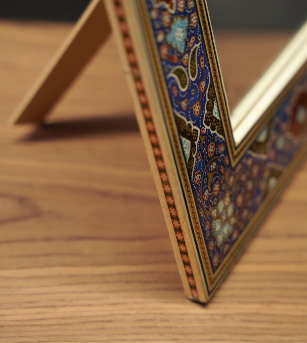 handmade tazhib mirror – indigo | 34×28 cm with intricate illumination-inspired design on a wooden frame.