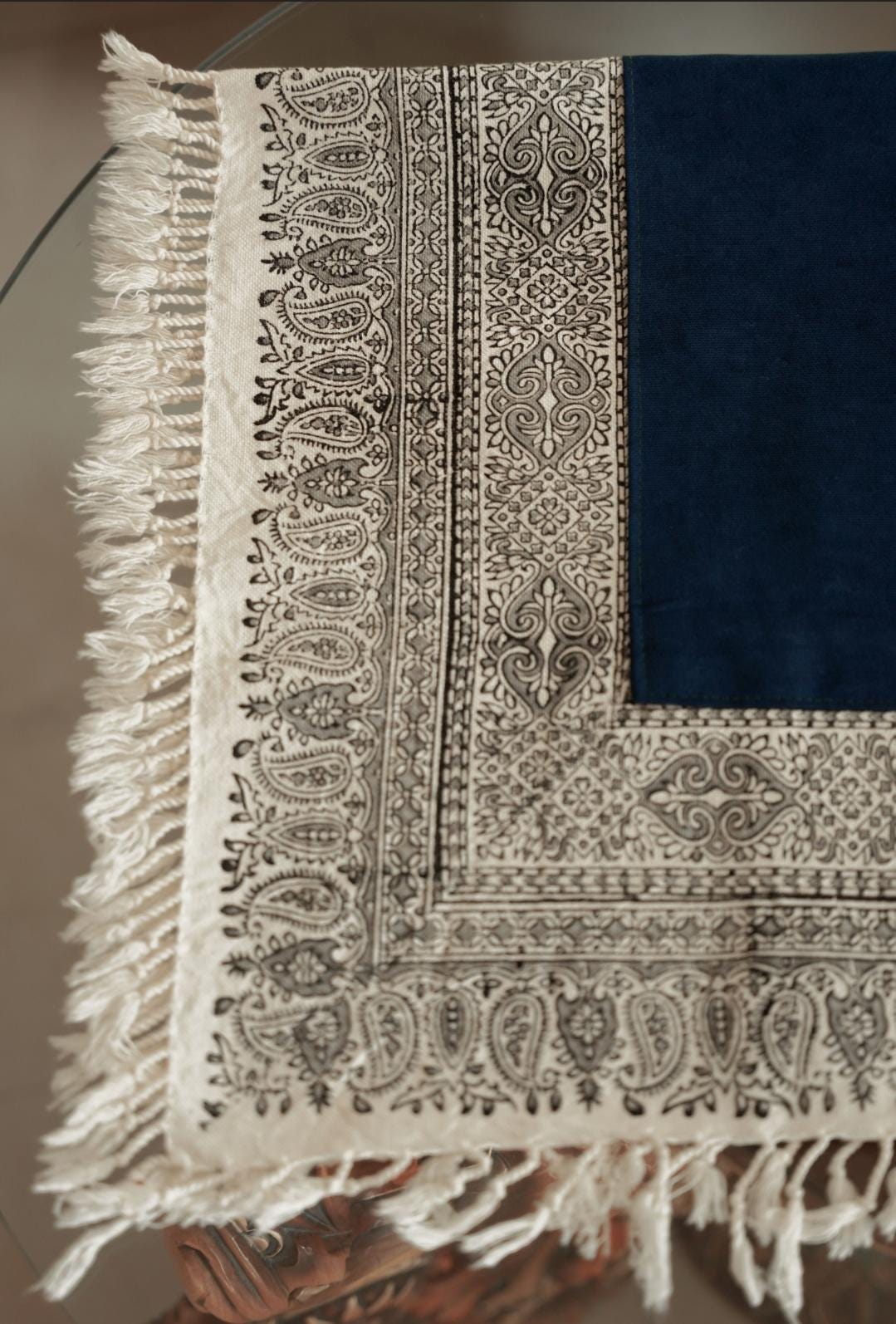 block printed cotton tablecloth featuring intricate border design and indigo fabric, perfect for elegant table settings.