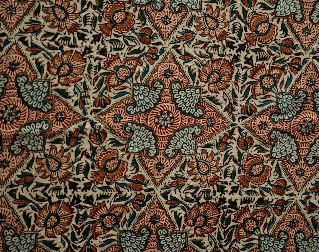 colorful block printed cotton tablecloth featuring intricate floral designs and patterns.