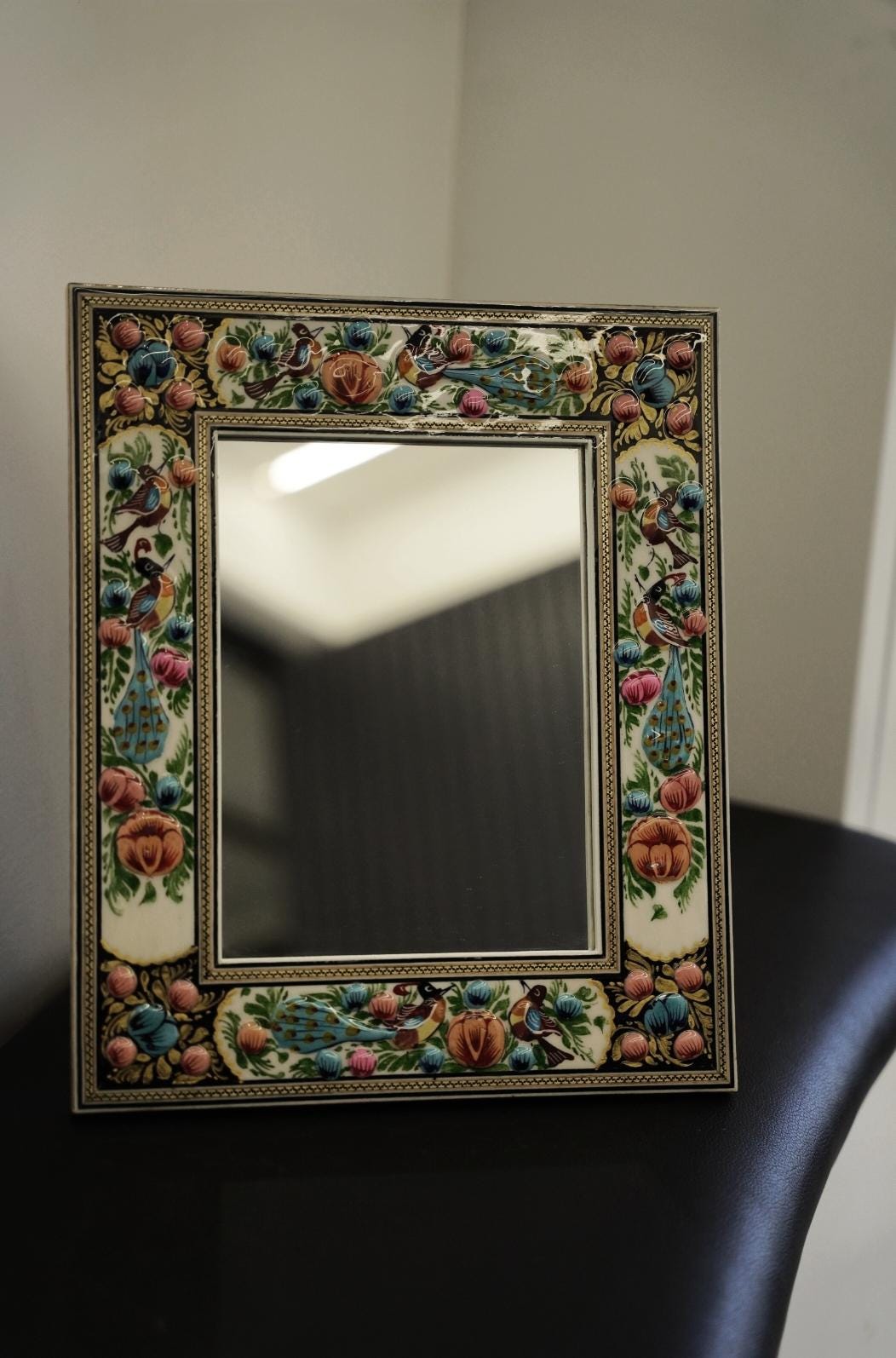 hand-painted relief enamel mirror – bird & bloom | 34×28 cm showcasing vibrant bird and floral designs.