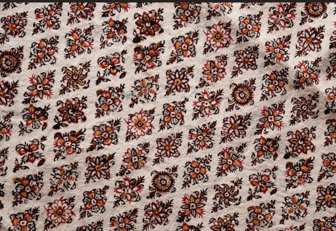 block printed cotton tablecloth featuring intricate floral patterns, designed for dining and home decoration.