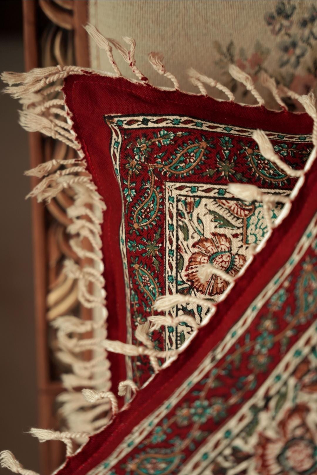 block printed cotton cushion covers with vibrant patterns and tassels adding cultural charm to home decor.