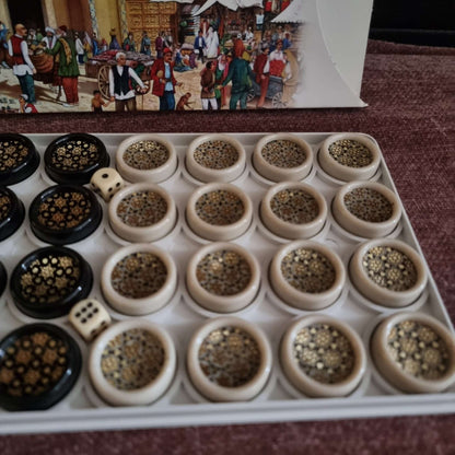 Khatam backgammon checkers set displayed with ornate pieces and dice on a velvet background.