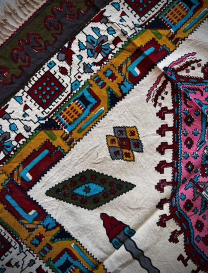 Block printed cotton textile featuring vibrant patterns in pink, terracotta, and geometric motifs.