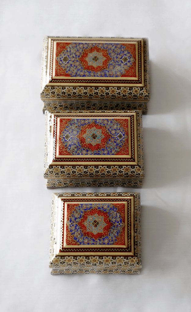 Handmade wooden decorative box featuring intricate tazhib and khatam marquetry in three sizes.