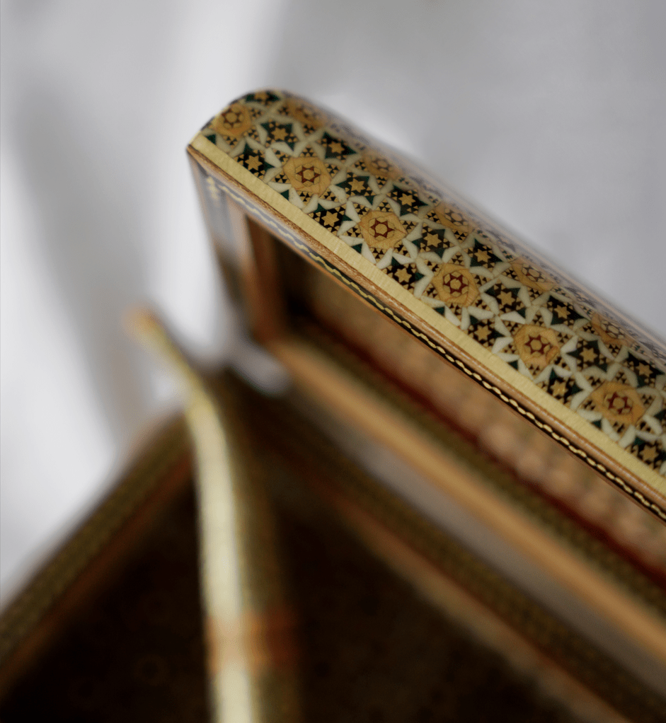 handmade wooden decorative box featuring intricate khatam marquetry and tazhib design details.