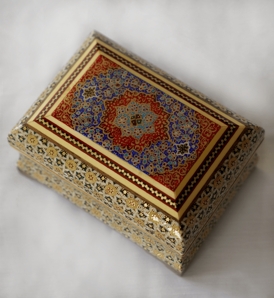 handmade wooden decorative box featuring intricate khatam marquetry and vibrant tazhib design.