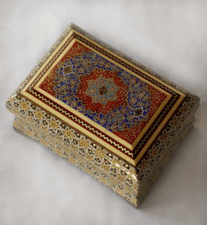 Handmade wooden decorative box featuring intricate khatam marquetry and vibrant tazhib design.