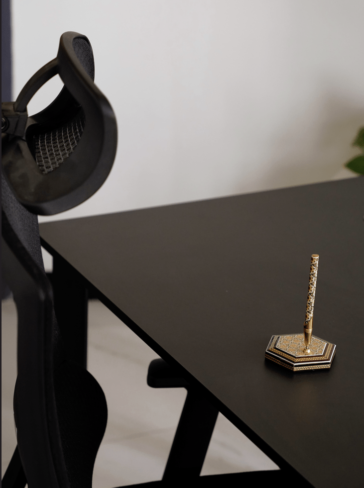 full khatam pen holder on a black desk, elegantly showcasing traditional marquetry craftsmanship.
