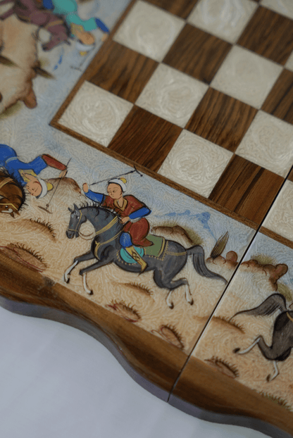 Detailed view of the polo scene chess backgammon set featuring hand-painted figures on the board.