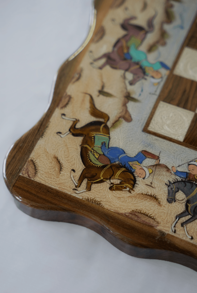 Detail of the hand-painted polo scene chess backgammon set featuring intricate horse and rider designs.