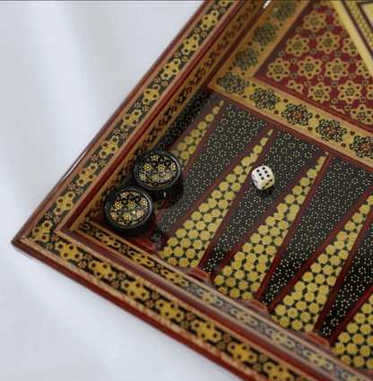 Khatam inlay chess and backgammon set featuring unique marquetry design and game pieces in play.