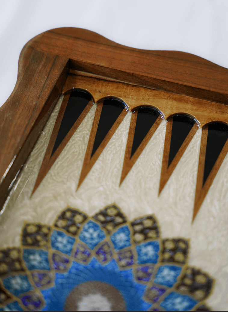 Close-up of Tazhib marquetry chess and backgammon set, highlighting intricate designs and fine woodwork.
