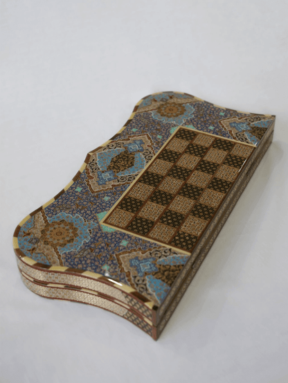 Hand-painted chess and backgammon set with intricate floral design, showcasing the collector edition craftsmanship by Pilardi.