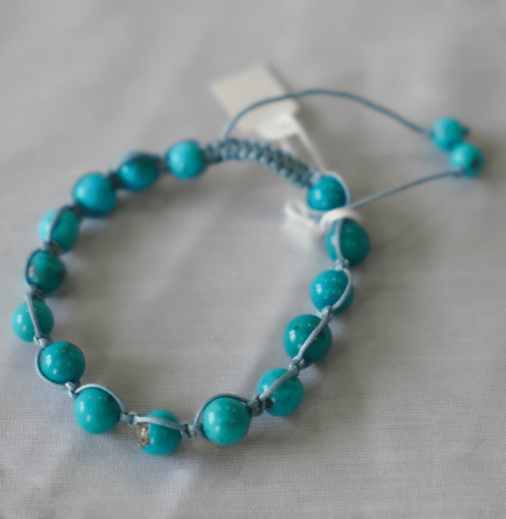 turquoise hand-braided gemstone bracelet featuring natural turquoise stones in a refined design.