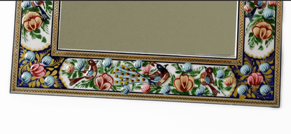 Hand-painted enamel wall mirror with intricate bird and floral frame design by Pilardi.