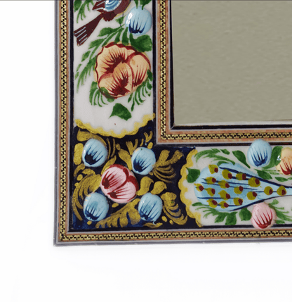 Hand-painted relief enamel mirror featuring a Bird & Bloom design with colorful floral and bird motifs.