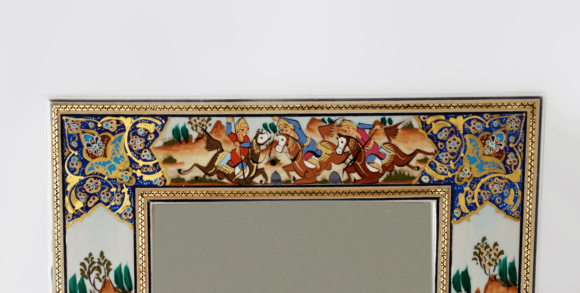 Hand-painted polo scene mirror featuring ornate frame with dynamic horses and riders in motion.