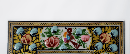 Hand-painted relief enamel mirror featuring vibrant florals and a colorful bird design.