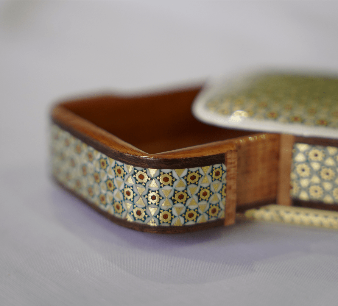 handmade wooden keepsake box with intricate marquetry and smooth sliding opening design.