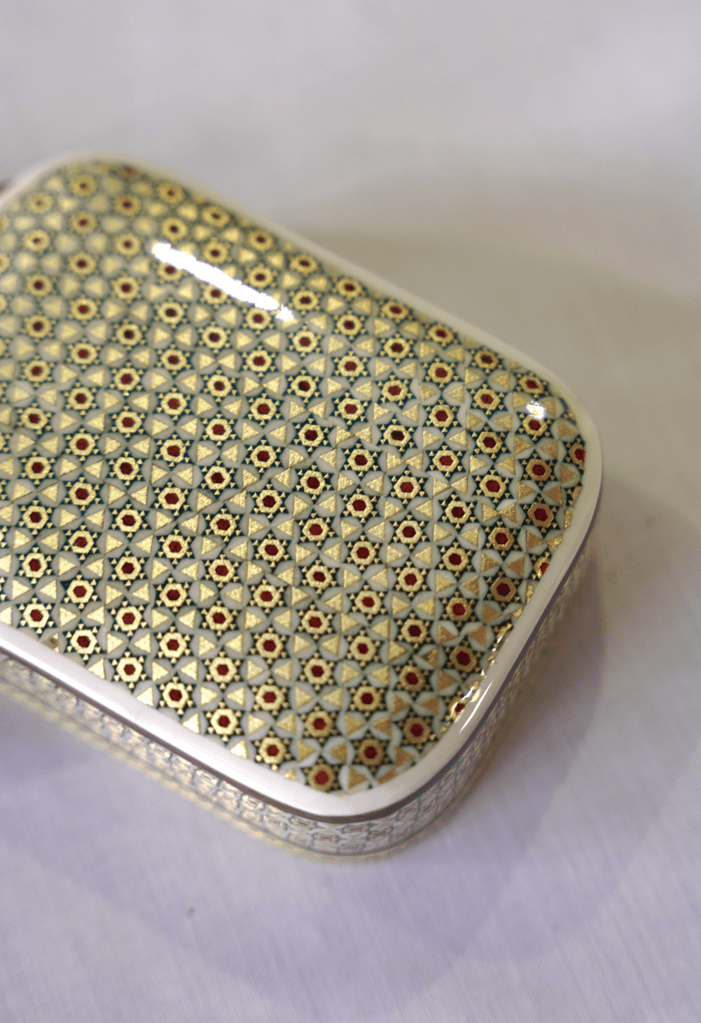 handmade wooden keepsake box with intricate marquetry design and glossy surface for durability.