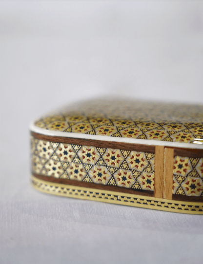 Handmade wooden keepsake box featuring intricate marquetry design and glossy finish.