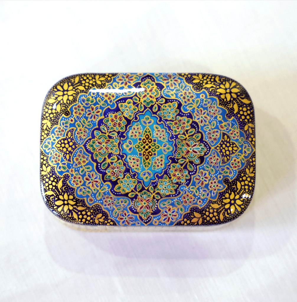 Handmade wooden keepsake box featuring a hand-painted Tazhib mandala in cobalt blue and intricate gold detailing.