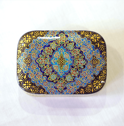 Handmade wooden keepsake box featuring a hand-painted Tazhib mandala in cobalt blue and intricate gold detailing.