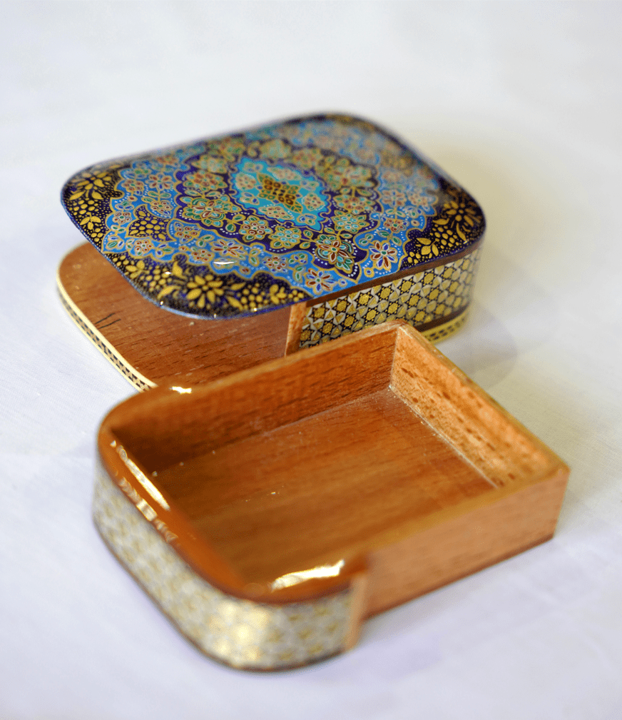 handmade wooden keepsake box with tazhib mandala design, featuring a vibrant blue and gold detailed lid.
