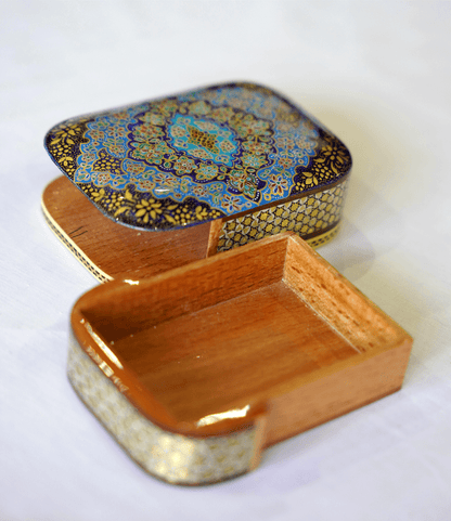 Handmade wooden keepsake box with Tazhib mandala design, featuring a vibrant blue and gold detailed lid.