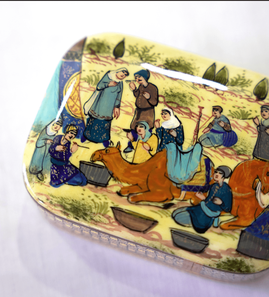 handmade wooden keepsake box featuring hand-painted scenes of traditional life with camels and people.