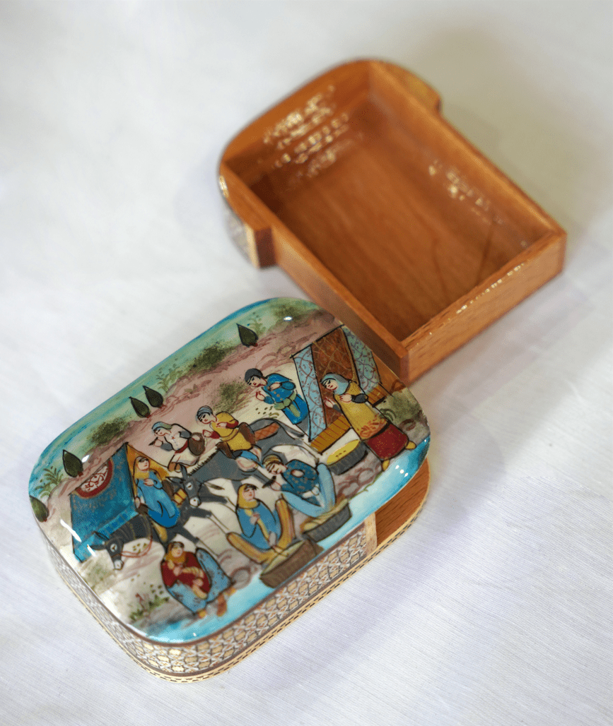 Handmade wooden trinket box featuring hand-painted artwork, displayed open with inner compartment visible.