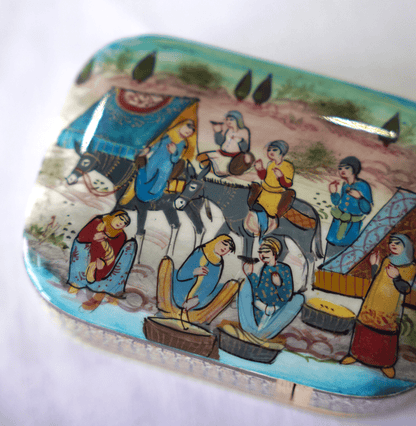 Handmade wooden trinket box featuring hand-painted artwork depicting vibrant scenes with people and horses.