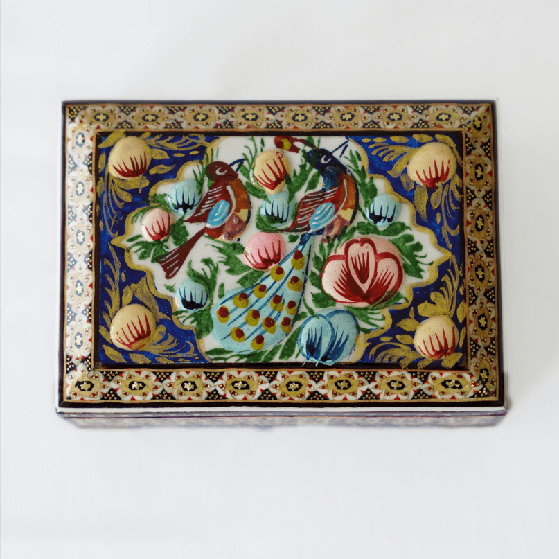 Handmade wooden jewelry box featuring hand-painted birds and flowers, showcasing textured details and vibrant colors.
