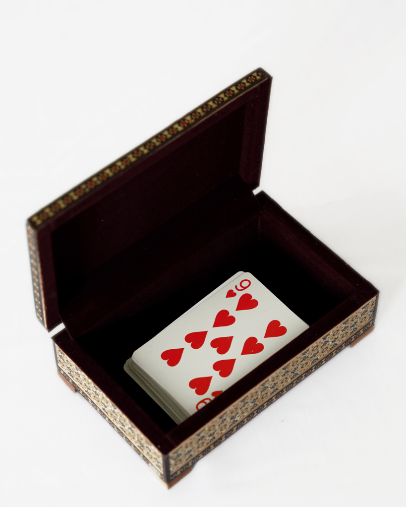 handmade wooden jewelry box with playing cards inside, showcasing intricate details and velvet lining.