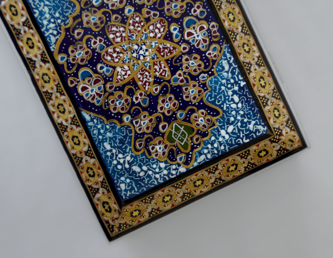 handmade wooden jewelry box with intricate hand-painted miniature lid and traditional detailing.