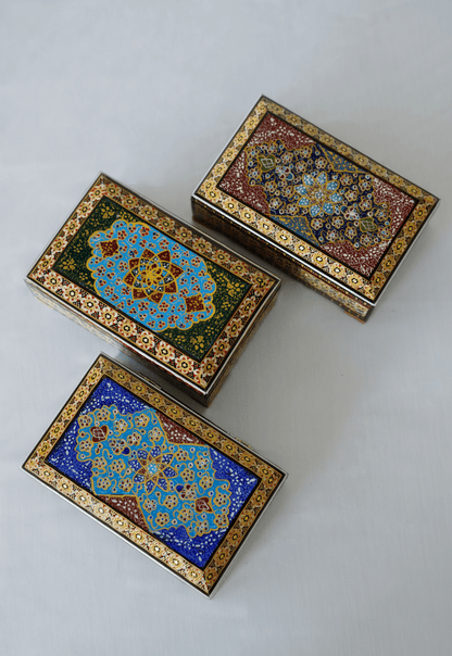 Handmade wooden jewelry box collection featuring intricate khatam marquetry and miniature painting designs.