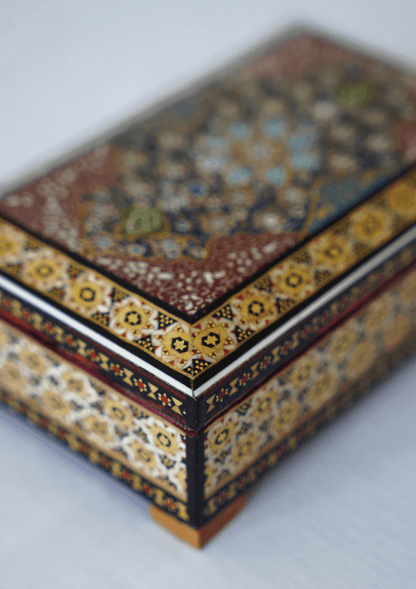 Handmade wooden jewelry box featuring intricate khatam marquetry and vibrant hand-painted miniature art.