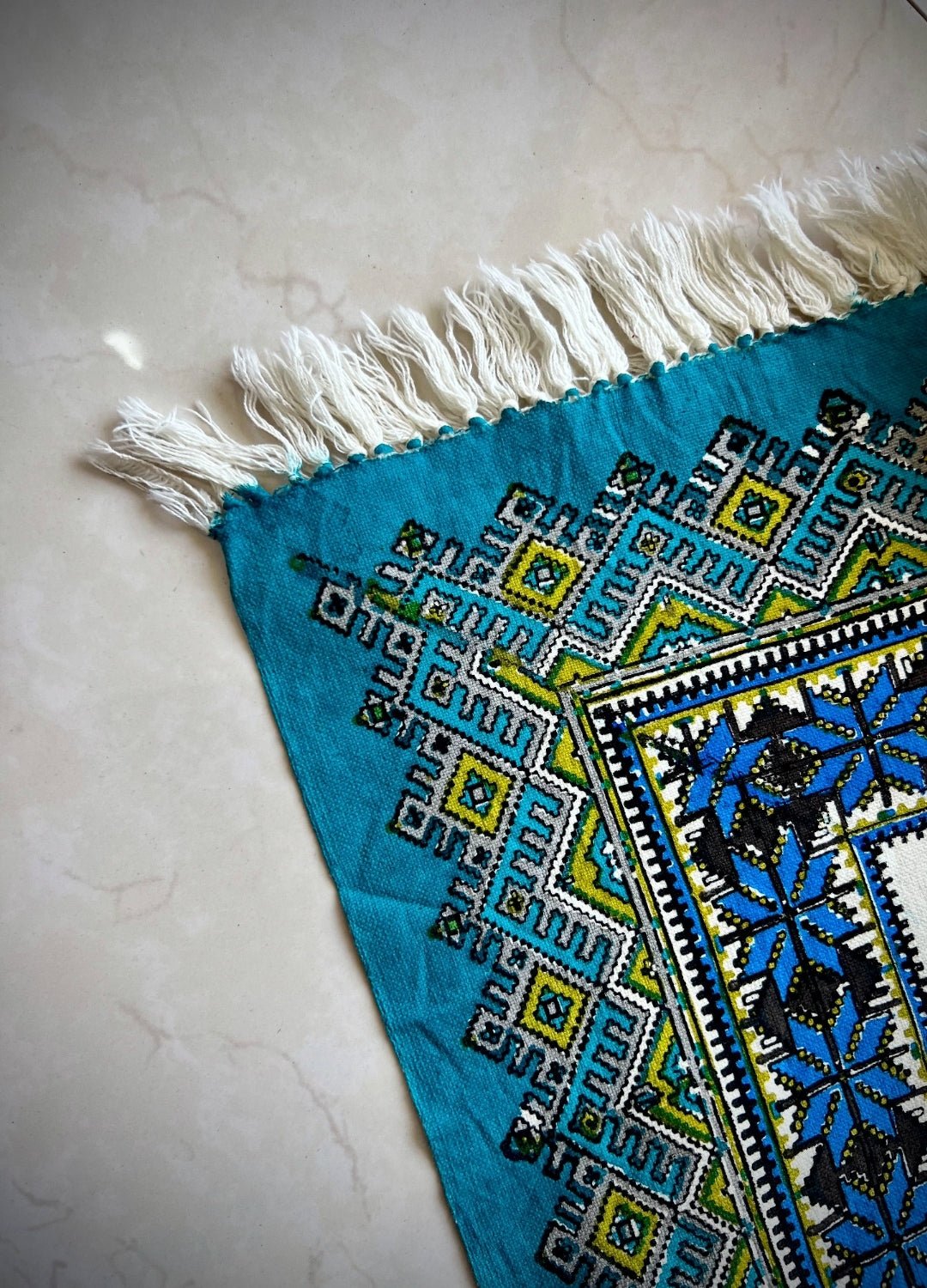 block printed cotton textile - firouzeh spread featuring bold geometric motifs in turquoise blue and intricate patterns.