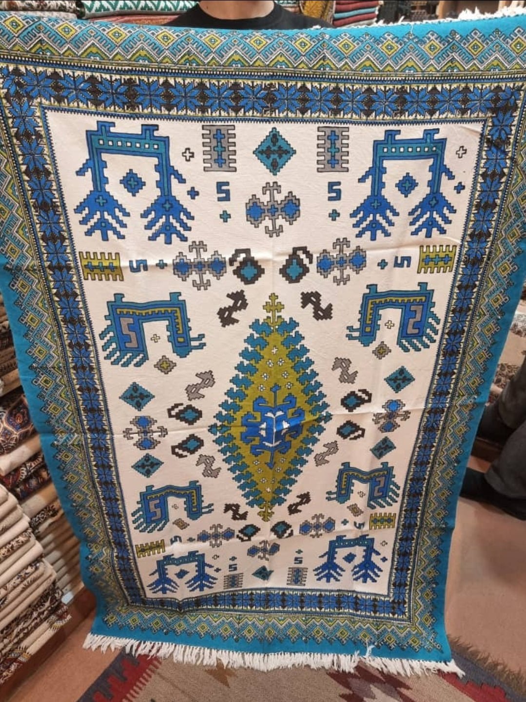 block printed cotton textile featuring bold geometric motifs in turquoise and blue colors, measuring 100 × 150 cm.